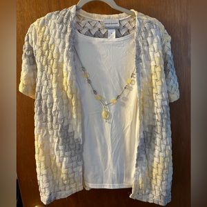 White tank top, necklace combo with yellow and gray cardigan.